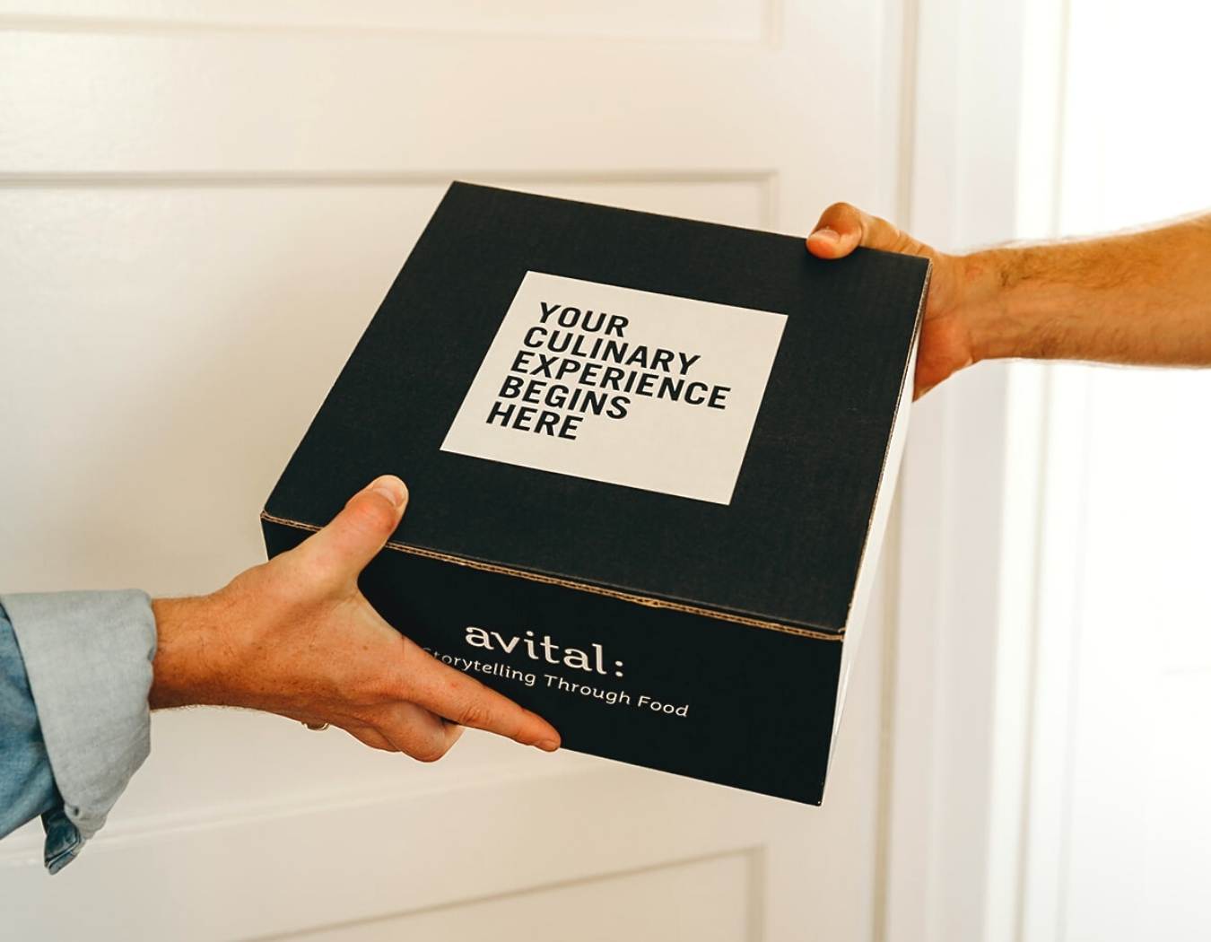 two hands delivering charcuterie chalet kit