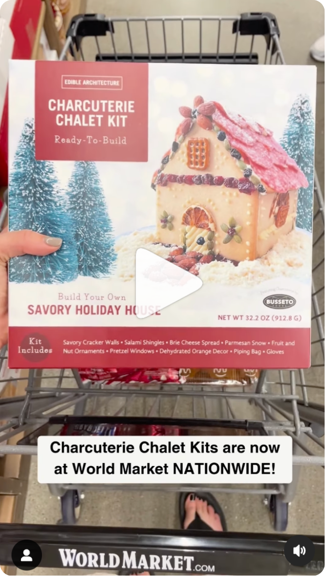 charcuterie chalet kit going into cart at world market